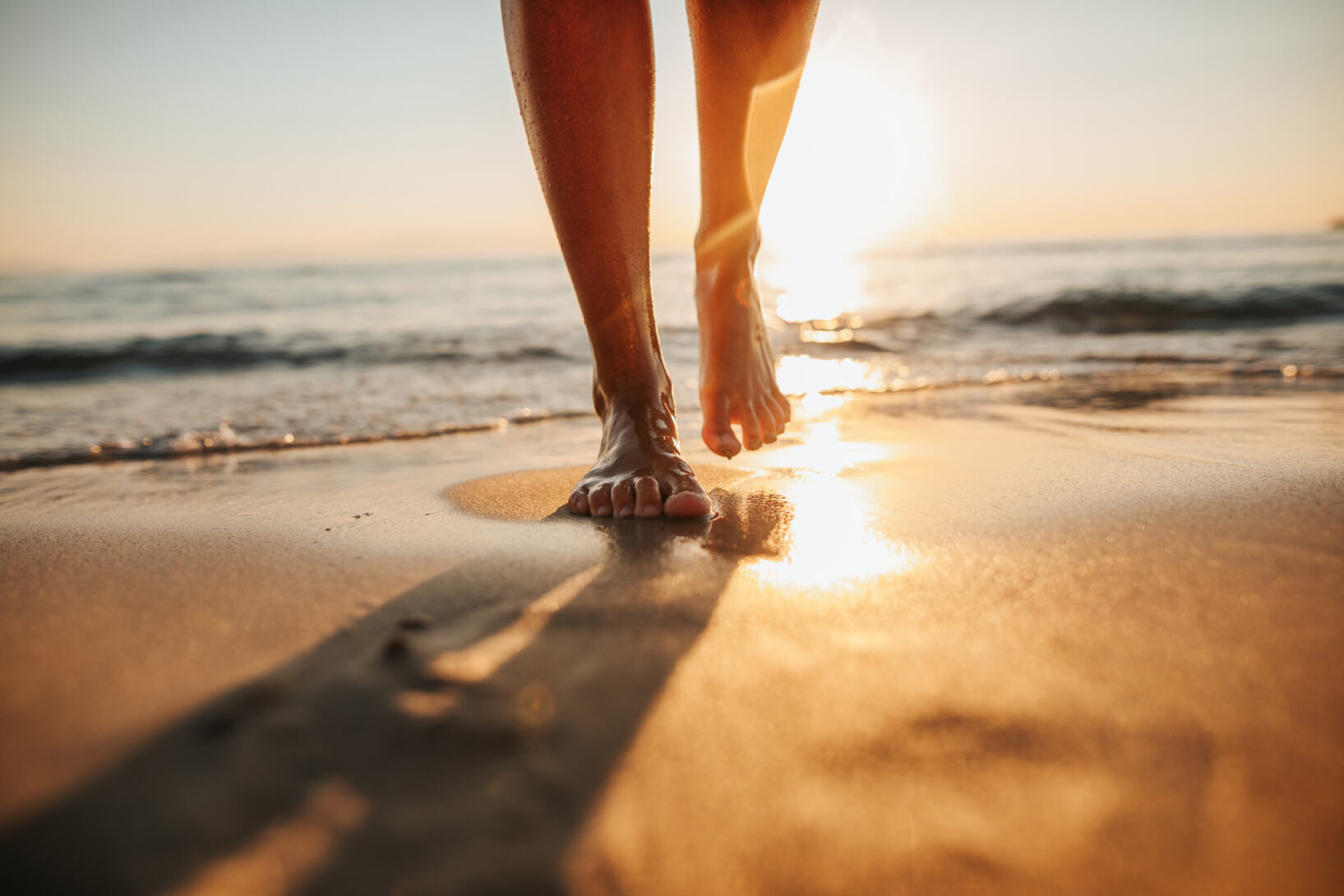Unghie dei piedi sani in spiaggia